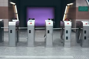 Many modern turnstiles outdoors. Fare collection system